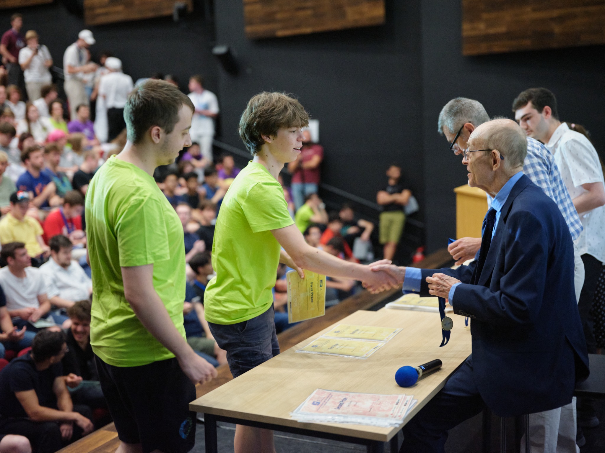 An IMC prize being presented to a student